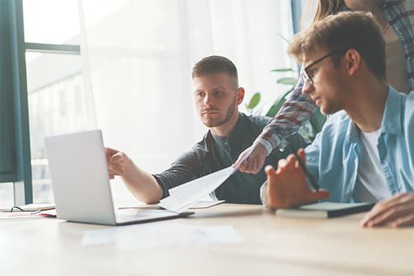 Two-men-discussing-company-growth